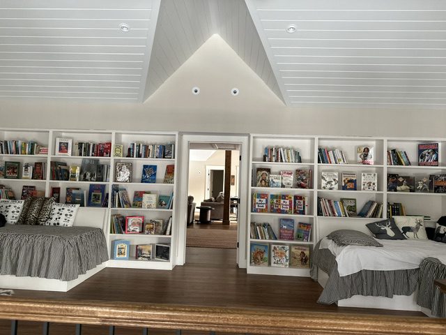 Cozy reading nook with built-in bookshelves and seating.